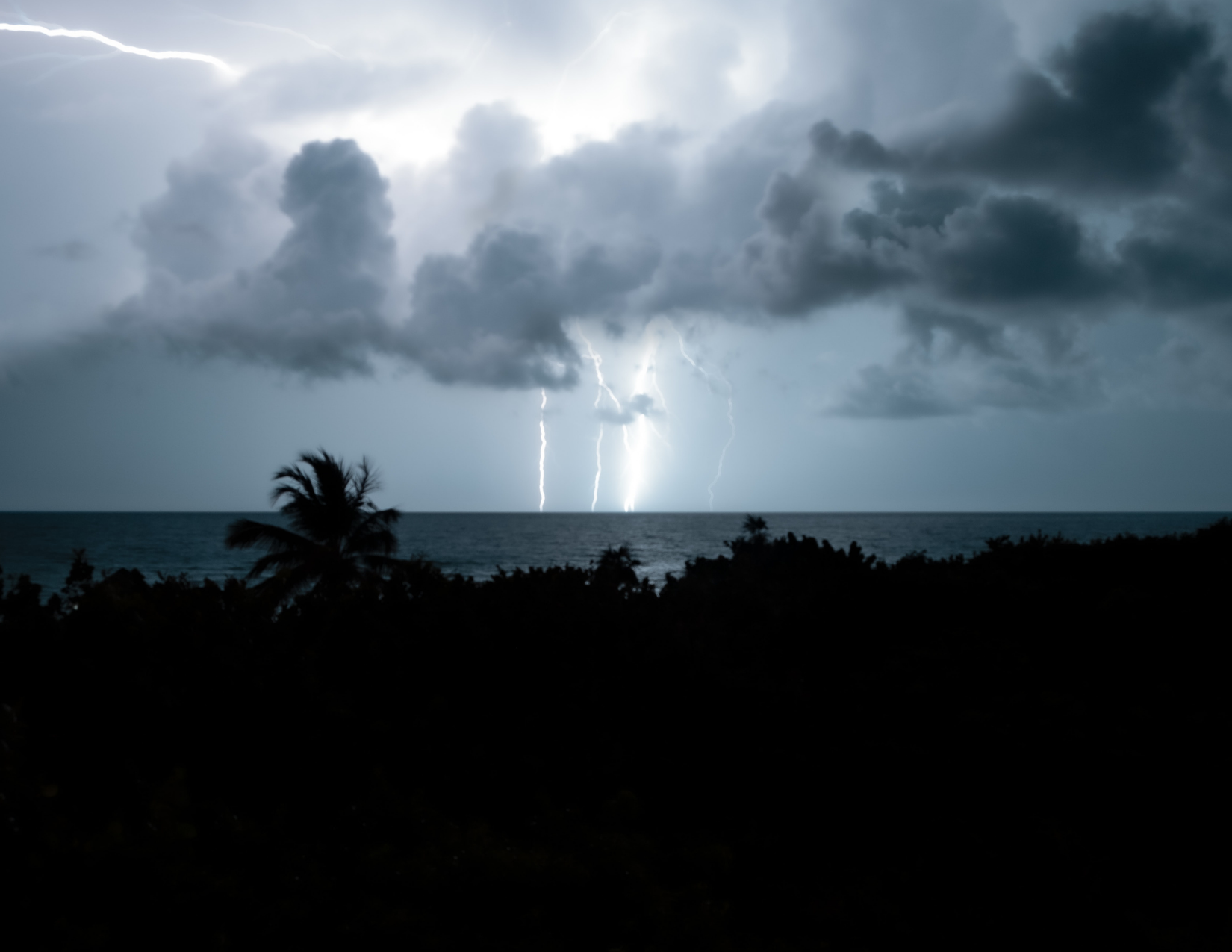 lighting striking ocean
